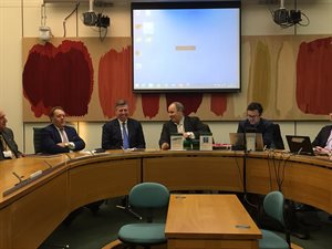 Image of senior Conservatives in a meeting room setting